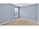 Bedroom features neutral walls and carpet, and a window at 2125 Arbor Vista Dr, Charlotte, NC 28262