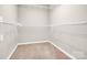 Walk-in closet featuring white wire shelving and neutral walls at 2125 Arbor Vista Dr, Charlotte, NC 28262