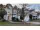 Inviting two-story home with stone accents, manicured lawn, and attached garage at 2125 Arbor Vista Dr, Charlotte, NC 28262