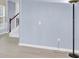 Hallway and stairs of home with fresh paint and wood-style floors at 2125 Arbor Vista Dr, Charlotte, NC 28262