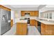 An updated kitchen with stainless steel appliances, an island and light countertops at 2125 Arbor Vista Dr, Charlotte, NC 28262