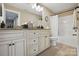 Bathroom featuring double sink vanity, framed mirror and granite countertops at 307 Jaida Ln, Oakboro, NC 28129