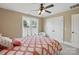Bedroom features natural light from a window and a ceiling fan at 307 Jaida Ln, Oakboro, NC 28129