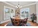 Spacious dining room with wood floors and a large window at 307 Jaida Ln, Oakboro, NC 28129