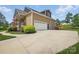 Home featuring a two-car garage and long concrete driveway at 307 Jaida Ln, Oakboro, NC 28129