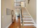 Spacious foyer with hardwood floors, staircase, and natural light at 307 Jaida Ln, Oakboro, NC 28129