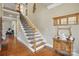 Inviting foyer with hardwood floors, staircase, and classic decor providing a warm welcome at 307 Jaida Ln, Oakboro, NC 28129