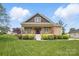Inviting home with a classic design, green lawn, and beautiful shrubbery at 307 Jaida Ln, Oakboro, NC 28129