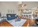 Spacious living room featuring hardwood floors and a comfortable seating area at 307 Jaida Ln, Oakboro, NC 28129