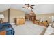 Expansive living room boasts neutral carpet, a bar, and comfortable seating arrangements at 307 Jaida Ln, Oakboro, NC 28129