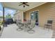 Covered patio featuring a dining table and chairs, perfect for outdoor entertaining at 307 Jaida Ln, Oakboro, NC 28129