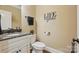 Stylish powder room with a granite countertop and 'Life is good' wall decor at 307 Jaida Ln, Oakboro, NC 28129