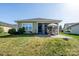 Expansive backyard boasts a patio, manicured lawn, mature landscaping, and a well-kept home exterior at 314 Flat Rock Dr, Denver, NC 28037