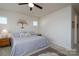Bright bedroom with cozy decor, neutral walls and carpet, and a comfortable bed and side tables at 314 Flat Rock Dr, Denver, NC 28037