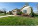 Charming single-story home featuring a one-car garage, well-manicured lawn and landscaping at 314 Flat Rock Dr, Denver, NC 28037