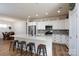 Kitchen featuring a large island with seating, stainless appliances, and sleek white cabinets at 314 Flat Rock Dr, Denver, NC 28037