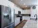 Modern kitchen showcasing stainless steel appliances, granite countertops, and white cabinetry at 314 Flat Rock Dr, Denver, NC 28037