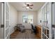 Bright office space with French doors, a ceiling fan, and a cozy reading nook at 314 Flat Rock Dr, Denver, NC 28037