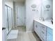 Bright bathroom with modern vanity, white cabinets, and walk-in shower featuring a sliding glass door at 314 Olympia Way, York, SC 29745