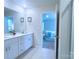 Clean, bright bathroom with double vanity and modern fixtures; opens to bedroom with carpet at 314 Olympia Way, York, SC 29745