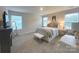 Cozy bedroom featuring neutral colors, plush carpet, and ample natural light from the large windows at 314 Olympia Way, York, SC 29745