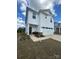 Two-story home featuring white siding, an attached garage, and a welcoming entryway adorned with seating at 314 Olympia Way, York, SC 29745