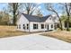 Well-lit view of the home's exterior, showing a driveway and manicured lawn on a sunny day at 315 Club House Dr, Salisbury, NC 28144