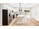 Clean, well-appointed kitchen with modern appliances, white cabinetry, and access to the backyard at 315 Club House Dr, Salisbury, NC 28144