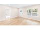 The bright living room features modern floors, natural light from large windows, and a doorway leading to the other rooms at 315 Club House Dr, Salisbury, NC 28144