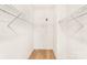 Spacious walk-in closet offers ample storage with wire shelving and sleek hardwood flooring at 315 Club House Dr, Salisbury, NC 28144