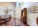 Dining room featuring a high ceiling, hardwood floors, large wooden table, and elegant decor at 320 Falesco Ln, Matthews, NC 28105