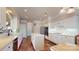 Spacious kitchen with white cabinetry, stainless steel appliances, and a center island on terra cotta tile at 320 Falesco Ln, Matthews, NC 28105