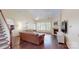 Bright living room with a fire place, hardwood floors, and staircase access at 320 Falesco Ln, Matthews, NC 28105