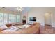 Bright living room with fireplace, hardwood floors, and cozy seating area at 320 Falesco Ln, Matthews, NC 28105