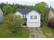 Ariel shot showcasing the home's location, landscaping, and proximity to surrounding greenery at 3254 Pikes Peak Dr, Gastonia, NC 28052