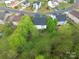 Aerial view displays lush backyard, offering a private retreat, and the home's roof at 3254 Pikes Peak Dr, Gastonia, NC 28052