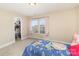 Charming bedroom with a bed, closet, and windows with soft pink curtains at 3254 Pikes Peak Dr, Gastonia, NC 28052