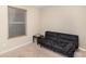 Cozy bedroom featuring a futon sofa, a side table, and a window at 3254 Pikes Peak Dr, Gastonia, NC 28052