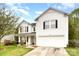 Charming two-story home with white siding, black shutters, and a well-maintained front yard at 3254 Pikes Peak Dr, Gastonia, NC 28052