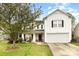 Charming two-story home with white siding, black shutters, and a well-maintained front yard at 3254 Pikes Peak Dr, Gastonia, NC 28052
