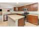 Functional kitchen featuring ample counter space, wood cabinetry, and stainless steel appliances at 3254 Pikes Peak Dr, Gastonia, NC 28052