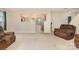 Spacious living room featuring neutral carpet, comfortable seating, and an open view to the kitchen at 3254 Pikes Peak Dr, Gastonia, NC 28052