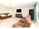 Inviting living room with cozy furniture, a large TV, and ample space for relaxation and entertainment at 3254 Pikes Peak Dr, Gastonia, NC 28052