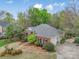 Spacious brick home featuring a manicured lawn and attached garage at 3866 Bethany Nw Ct, Concord, NC 28027