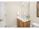 The half bathroom showcases a wood vanity and toilet at 3866 Bethany Nw Ct, Concord, NC 28027
