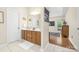 Bathroom featuring double vanity, framed mirror, tile flooring, and attached bedroom at 3866 Bethany Nw Ct, Concord, NC 28027