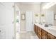 Bright bathroom with tile floors, double vanity, and bathtub in the adjacent room at 3866 Bethany Nw Ct, Concord, NC 28027