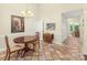 Inviting dining room with tile flooring, charming chandelier, and easy access to additional rooms at 3866 Bethany Nw Ct, Concord, NC 28027