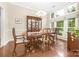 Dining room with hardwood floors, large windows and traditional furnishings at 3866 Bethany Nw Ct, Concord, NC 28027