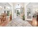 Bright foyer featuring tile floors, decorative front door, and views to the dining room at 3866 Bethany Nw Ct, Concord, NC 28027